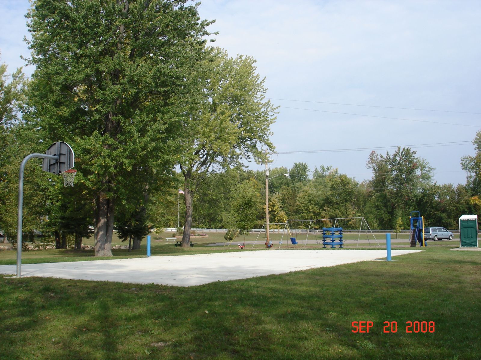 Basketball court surrounded by trees