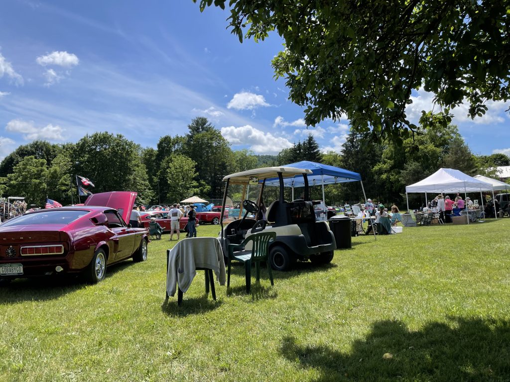 Cars and chairs in park
