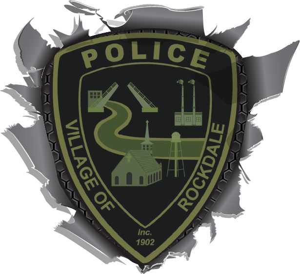Rockdale village police badge in green and black with “POLICE,” “VILLAGE OF ROCKDALE,” and “Inc. 1902” plus city icons.